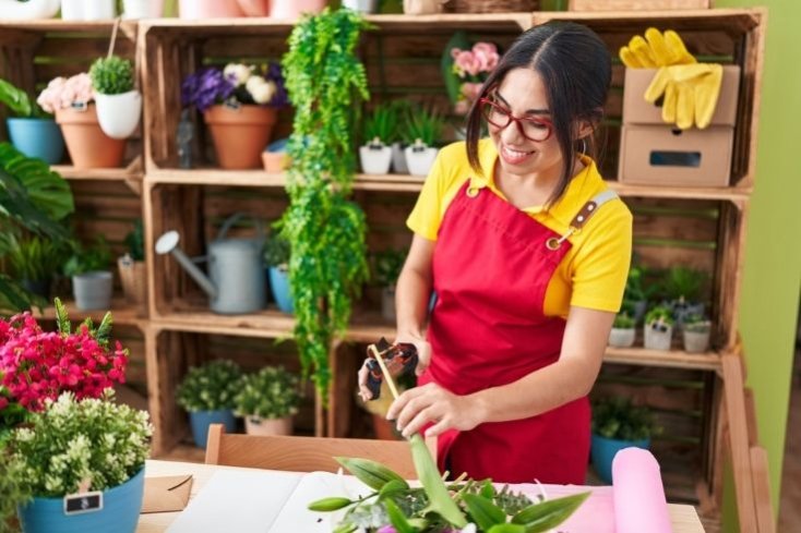 Woman cutting plants