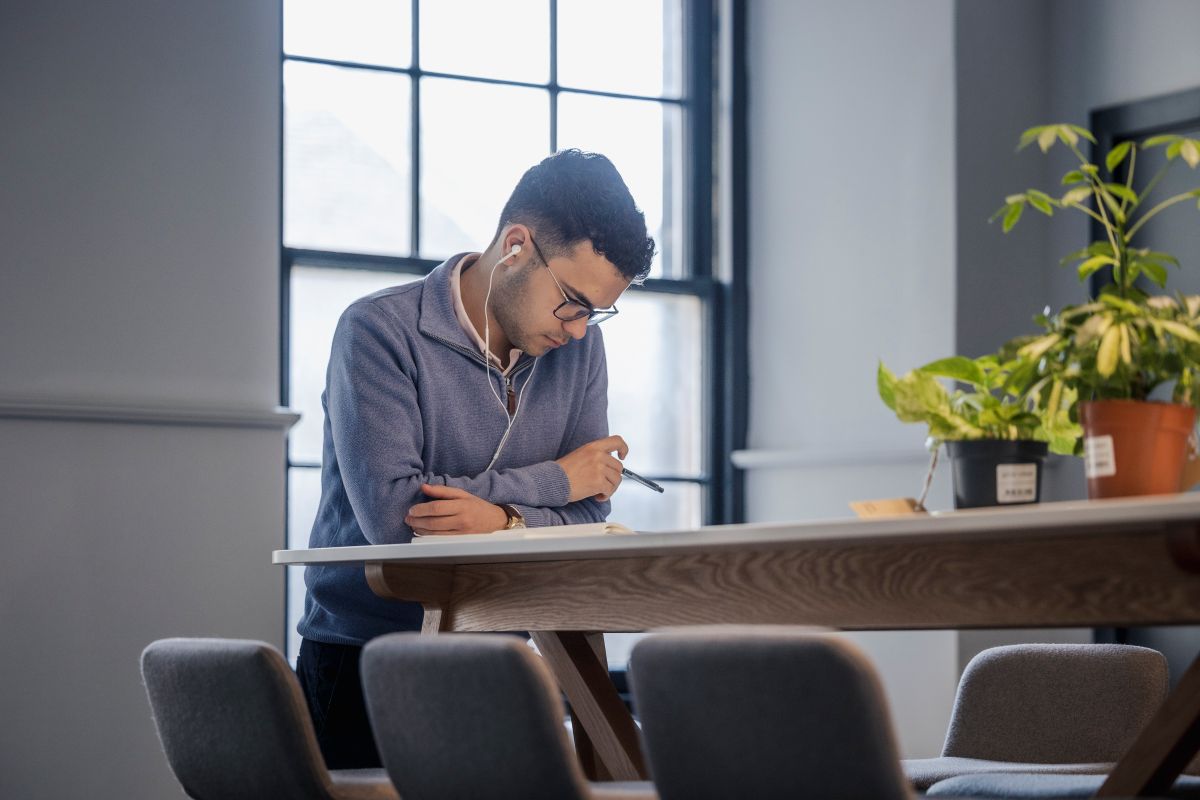 man on laptop working at a desk