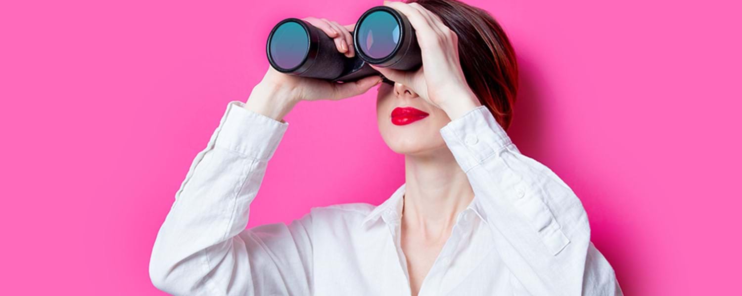 woman holding a pair of binoculars