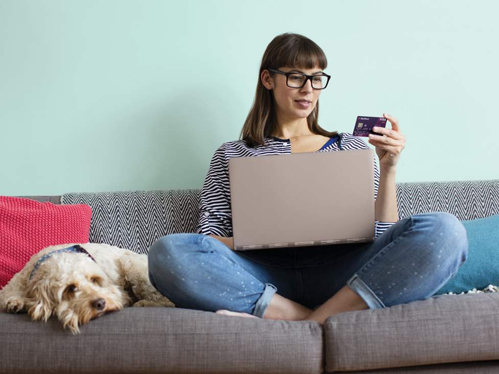 Woman paying on debit card