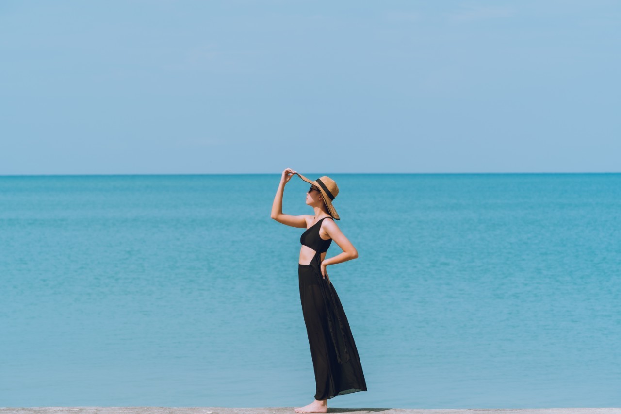 woman standing on the beach