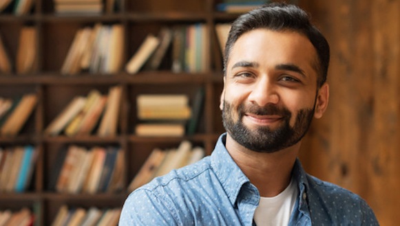 Man smiling directly at camera