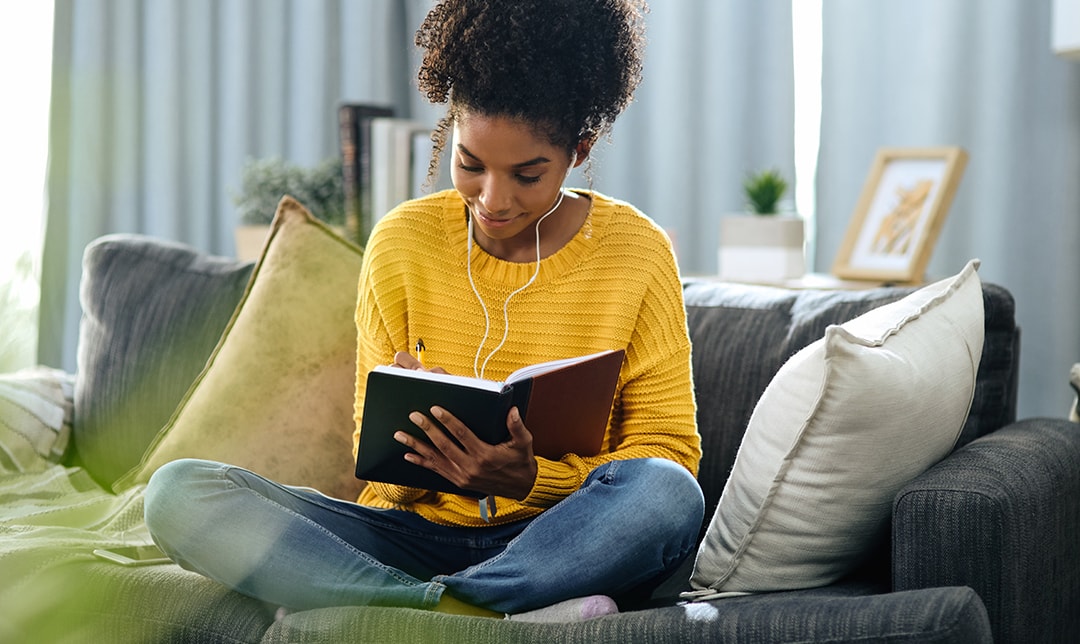Woman writing in notebook