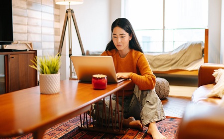 young woman working on her laptop